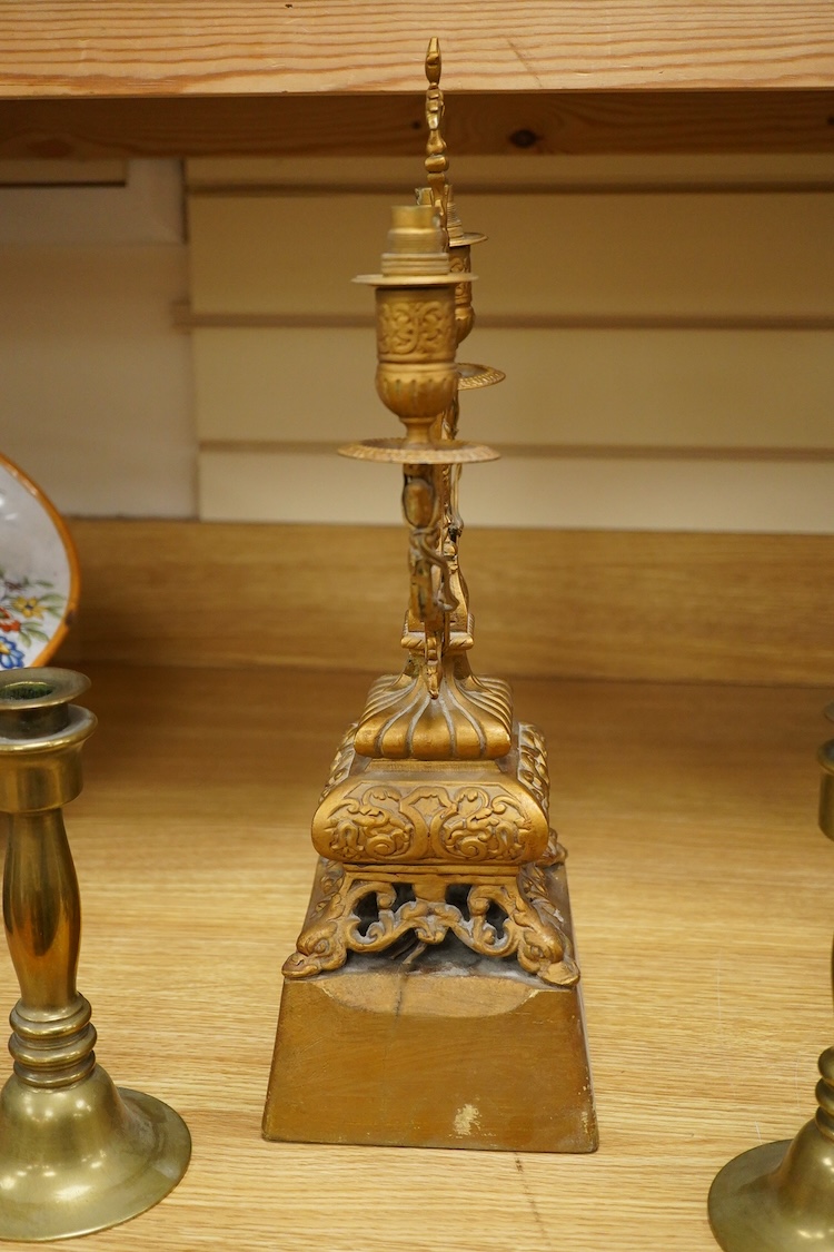 A pair of brass candlesticks and a gilt metal two branch gilt candelabrum, 45cm high